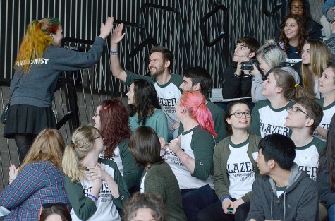 A winning student gets a high five.