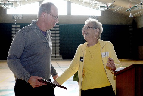 Fern Valentine congratulates Wenatchee adviser Dave Riggs for earning the Freedom of Expression award.