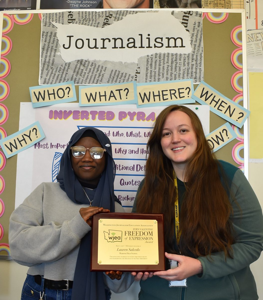 Mariner City News editor-in-chief Aisha Sallah (left) and adviser Lauren Salcedo hold the WJEA Fern Valentine Freedom of Expression Award. 
